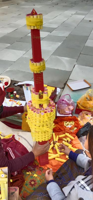 Helping my threoma lopen in making sokshing inorder put inside the chorten