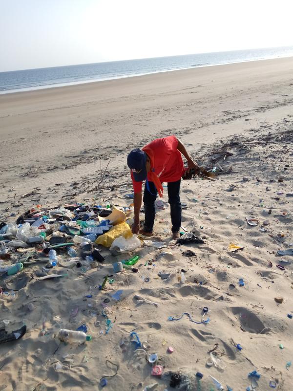 A community service at shela beach cleaning up 