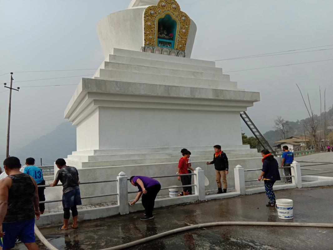 white washing the dewathang chorten