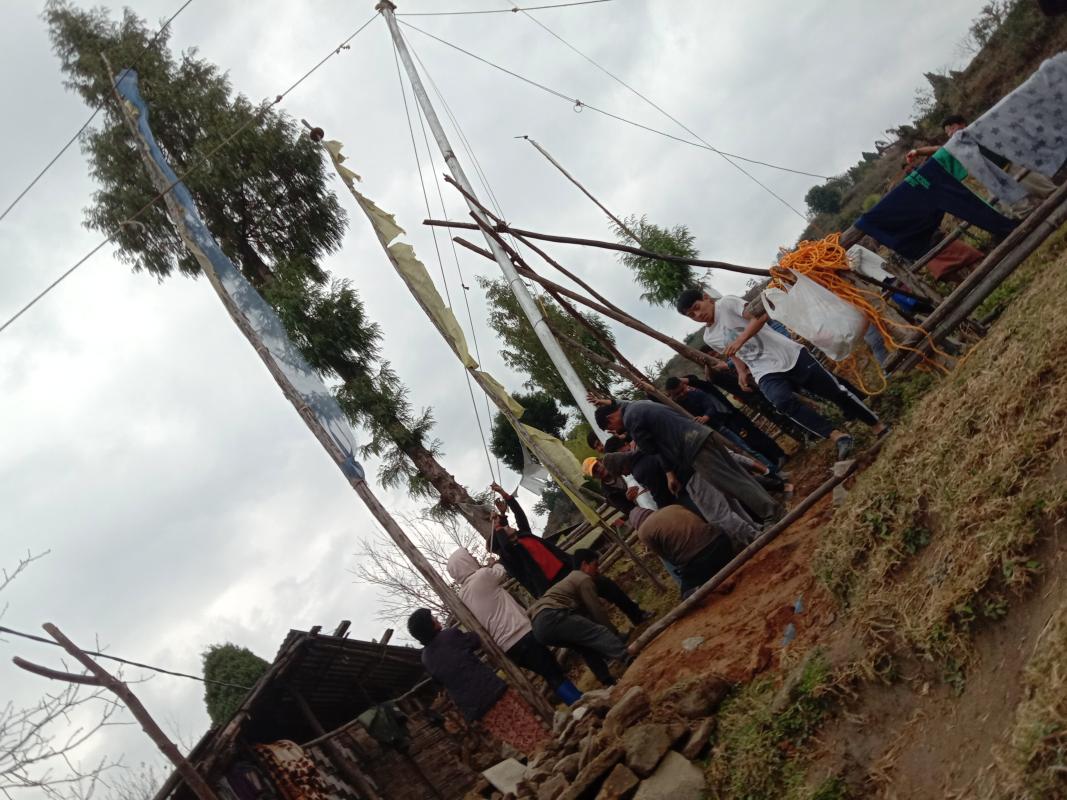 Hoisting prayer flag