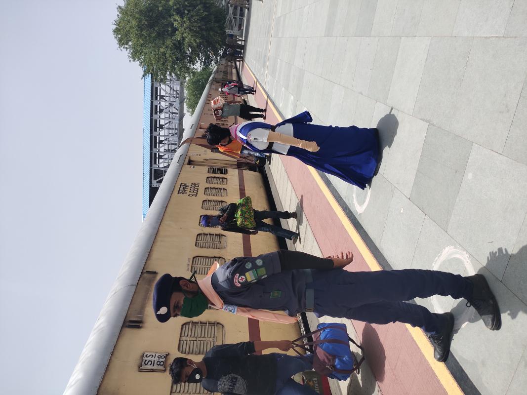 QUEUING PEOPLE AT RAILWAY STATION