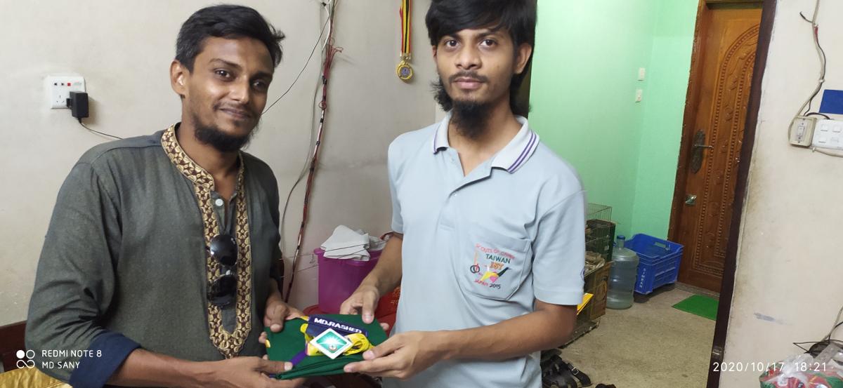 Group scarf and name plate handed over