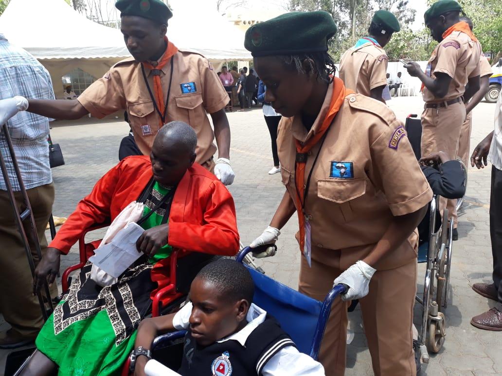 university of Nairobi  rover scouts giving service at a medical camp for the physically challenged
