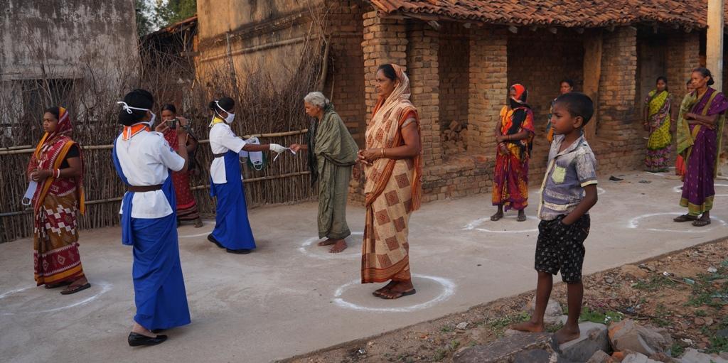 Creating awareness and masks distribution at Kharla village
