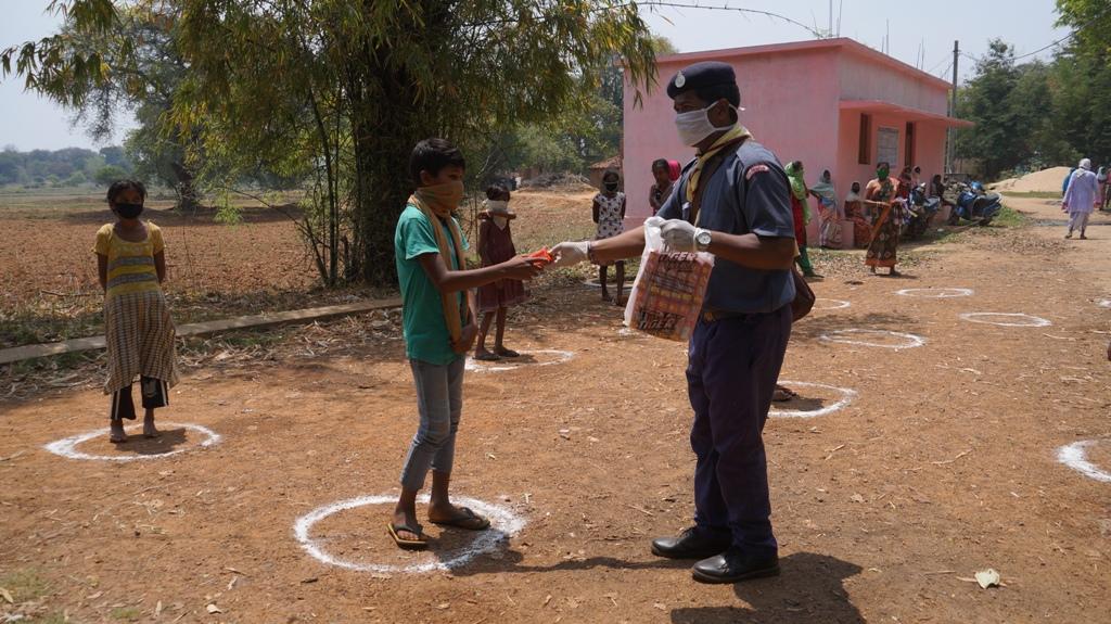 Snacks, biscuits distribution at Kisanpada of Kutra village, Block-Kutra