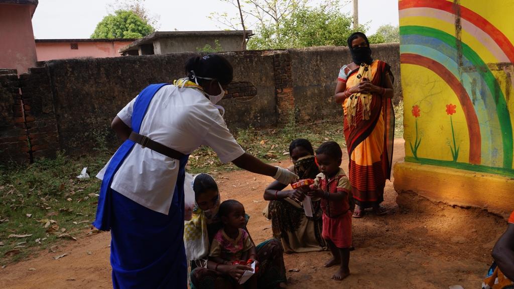 Snacks, biscuits distribution at Mangapada of Telighana village, Block-Kutra