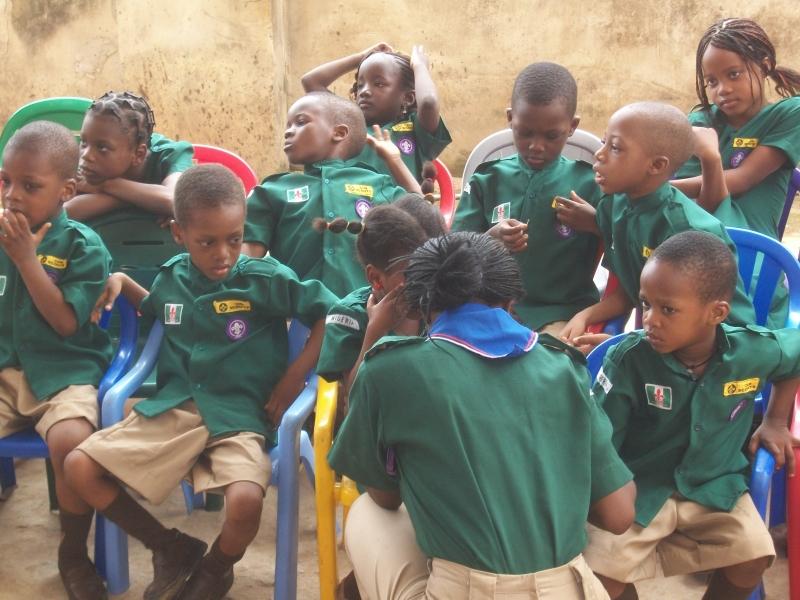 NIGERIA YOUNG SCOUTS PAY COURTESY MESSENGERS OF PEACE VISIT TO THEIR SCHOOL PRINCIPAL DURING A WEEK LONG HOLIDAY CAMPING.