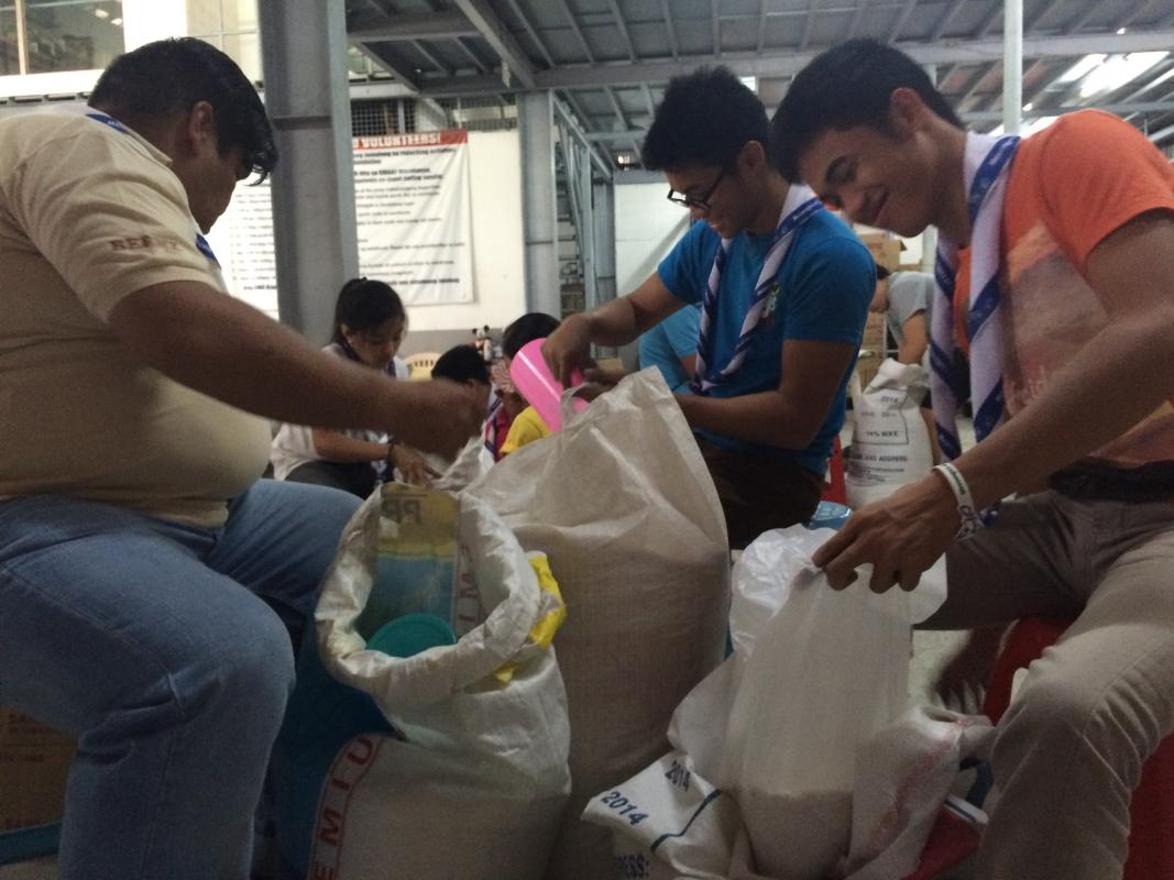 MoPph team brighton venturers helps to re-pack relif goods  