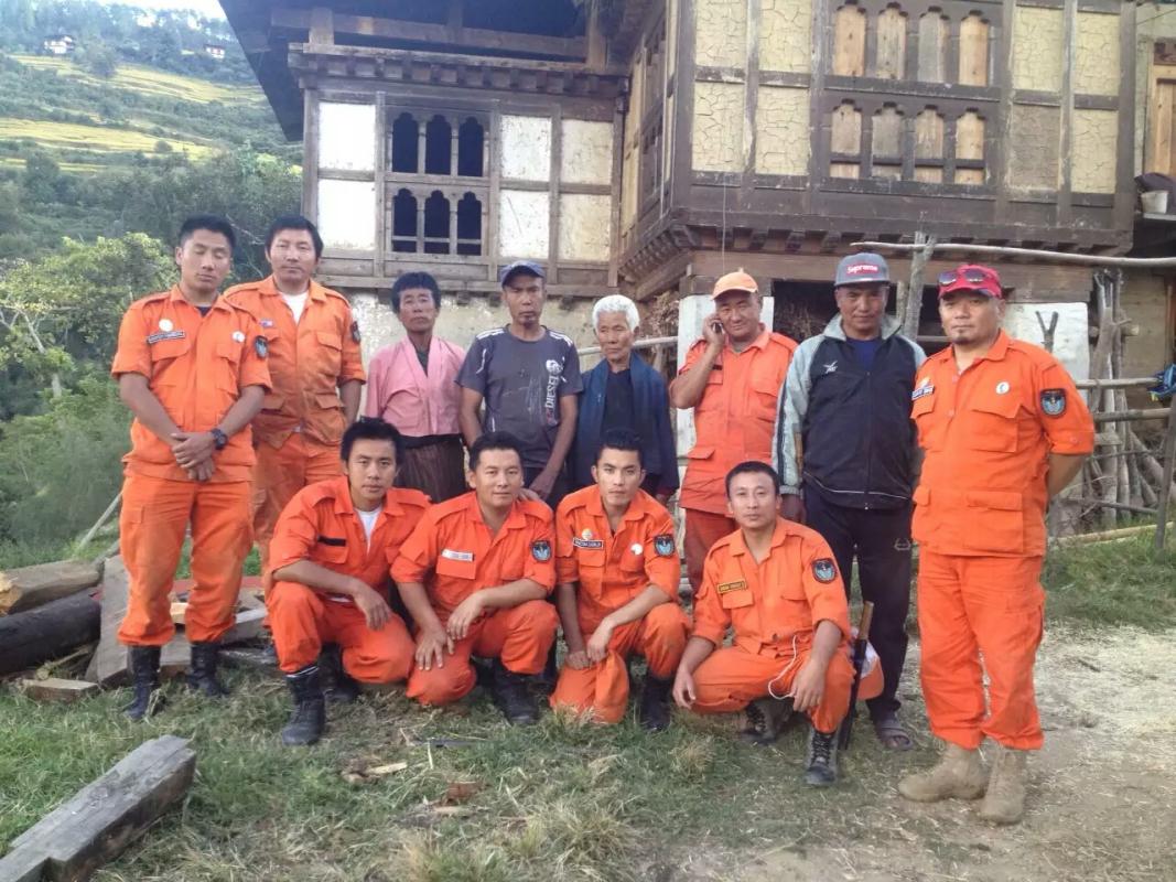 Helping in roofing the house which got blown away by the wind
