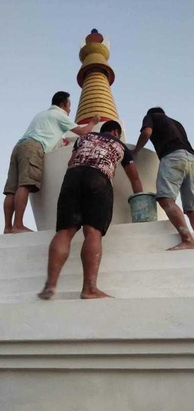 Brightening the golden stupa