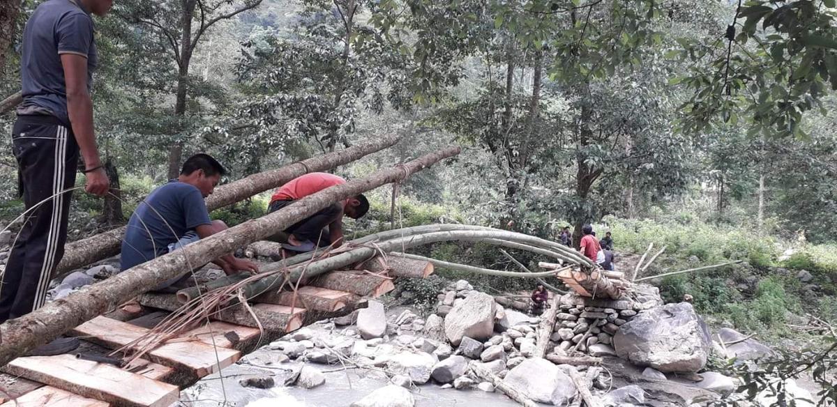 Community Based Scouts build a bridge over Pangkheykhola river 