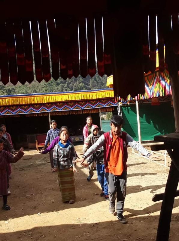 Teaching dance to kids.