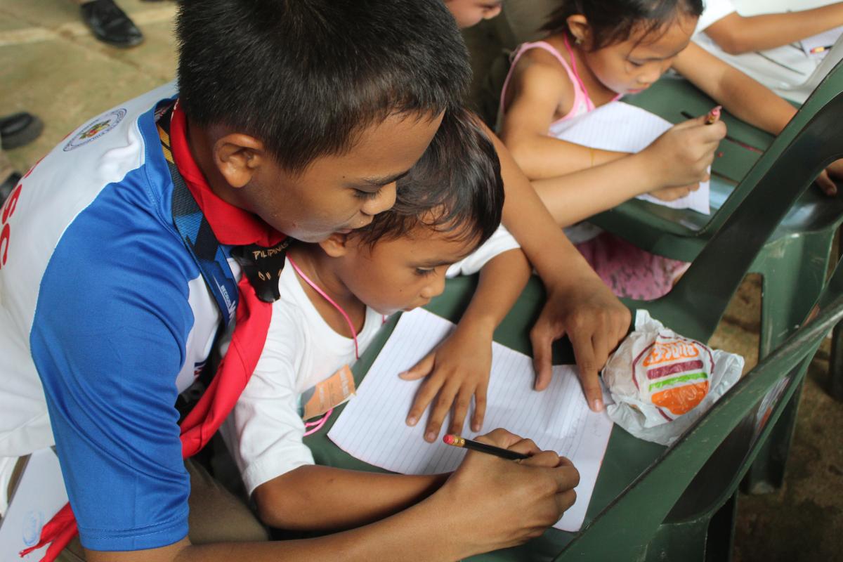 This is me helping one kid write what they want to be went they grow up