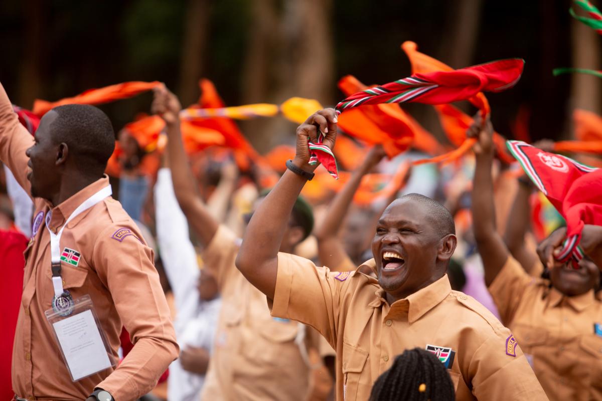 Scouts swinging their scarves in the air