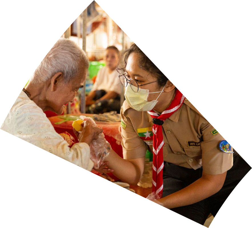 scout helping an elder