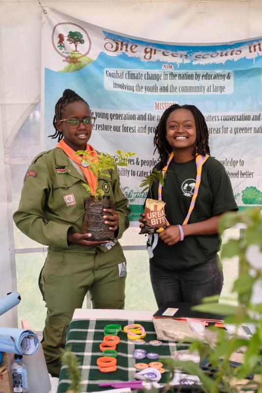 Young scouts planting seedlings 