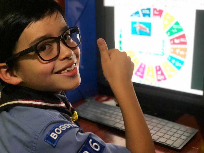 A young scout smiling 