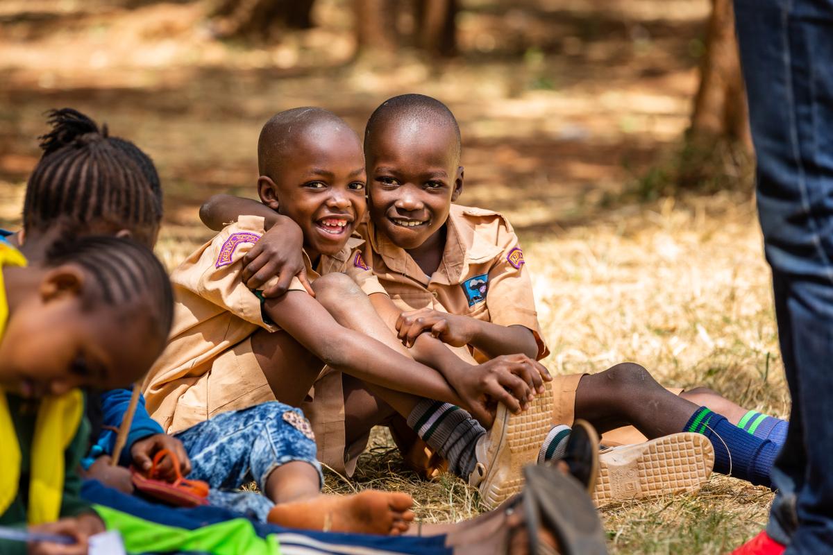 Young scouts showing affection for one another 