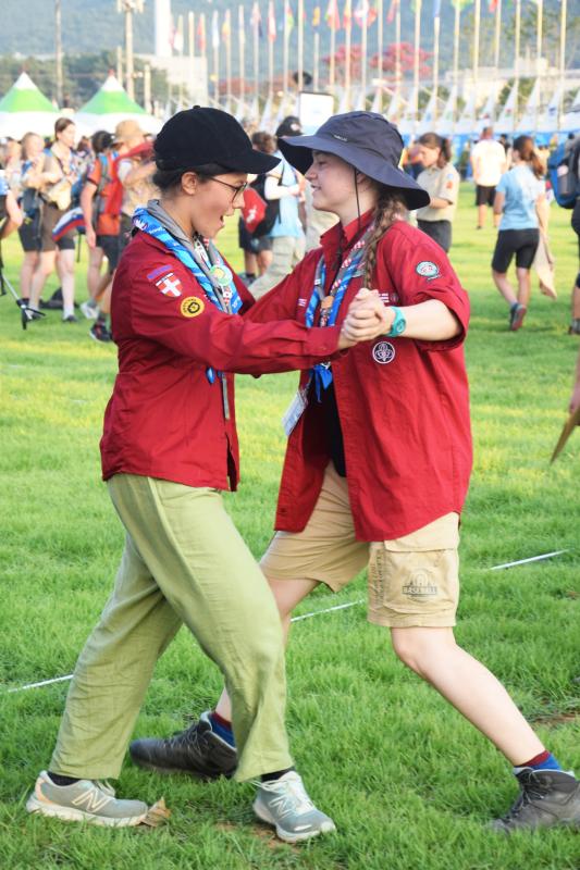 Two young scouts dancing