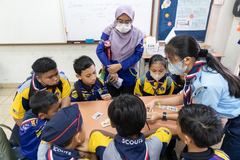 Young scouts playing card games 