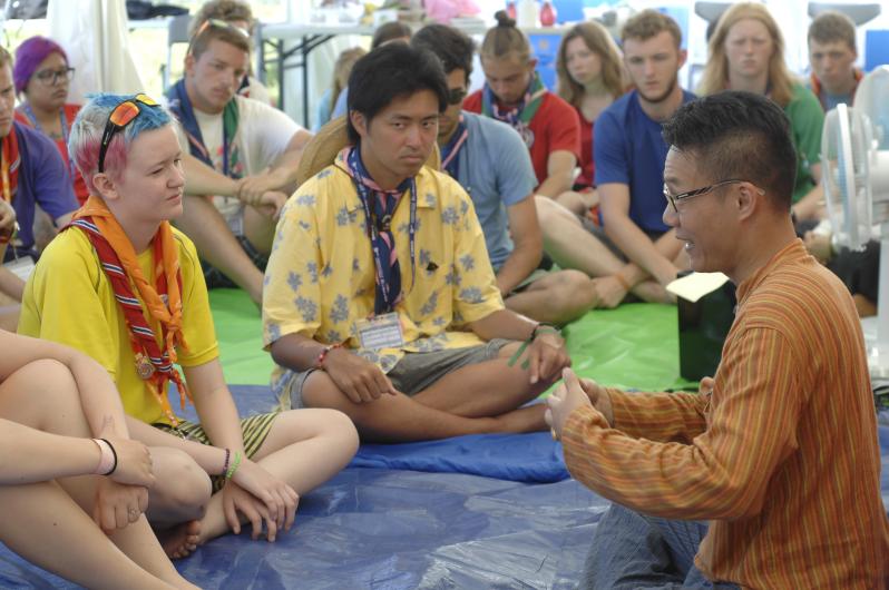 A person describing to a group