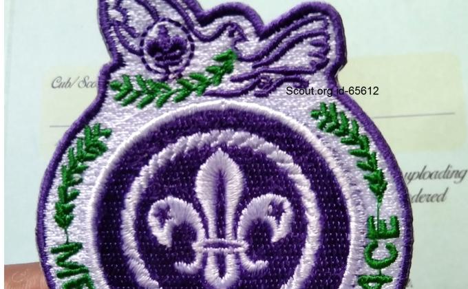  Massenger of peace ring badge.