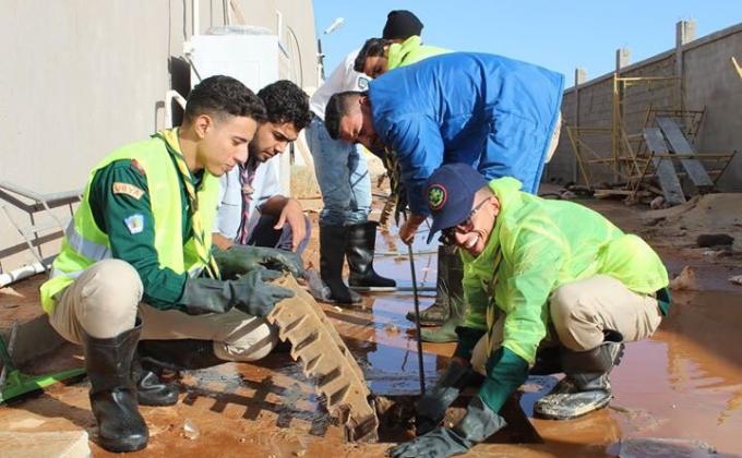 Benghazi Scouts Commission initiated a volunteer campaign to help resolve the crisis of the constant flooding of its city's streets