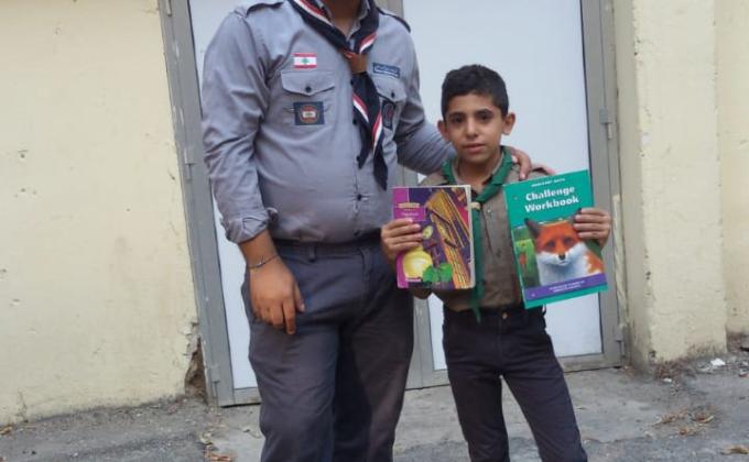 توزيع كتب صيفية على الكشافة والجراميز