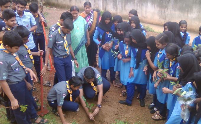CREATING A GREEN UMBRELLA FOR EARTH BY SCOUTS & GUIDES OF RAJAH'S
