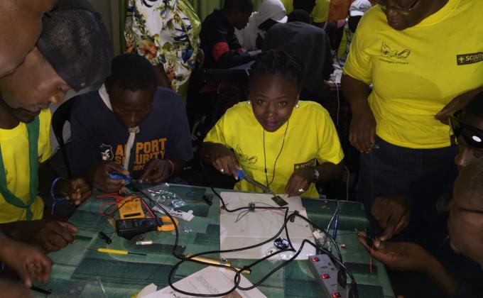 PARTICIPANTS MAKE THEIR OWN SOLAR LAMPS