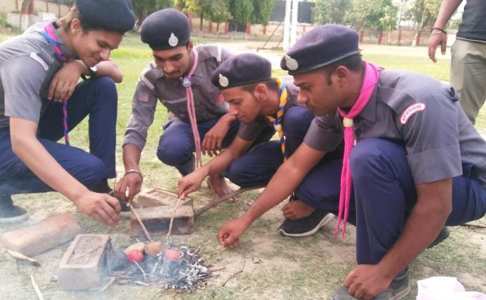 my scouts nd rover's Service and back woods man coking at charabgh lko