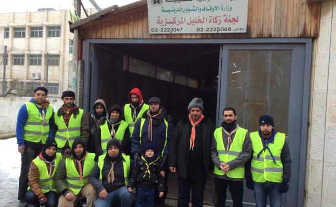Hebron Scout Group In cooperation with Hebron Zakah committee in helping needy .
