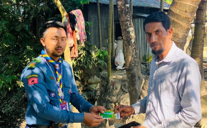 Scouts distributing seeds to local community members