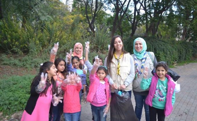 Cleaning our community park as part of the environmental responsibility تنظيف المنتزه كواجب بيئي 