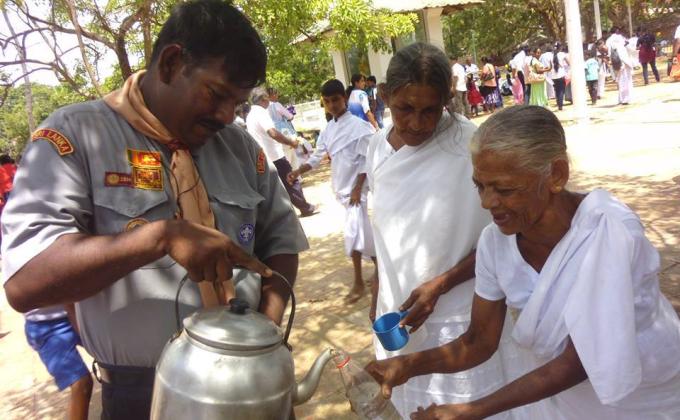 Scouts  from Sri Lanka  provide free water to the Devotees 