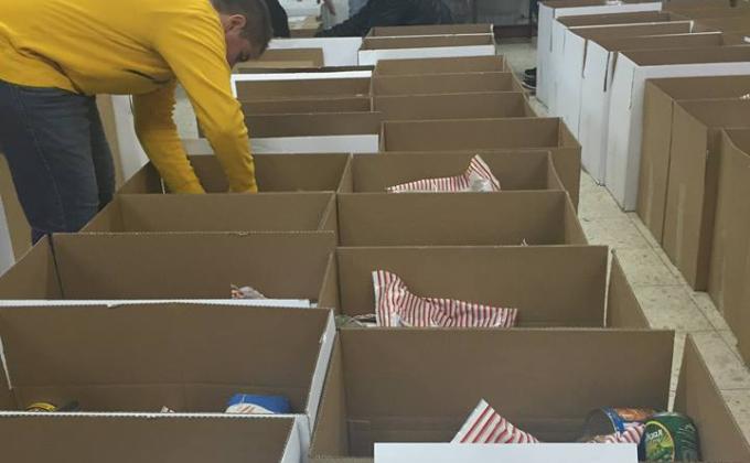 Distribution of food packages and supplying products to the poor and unfortunate families in the area.
