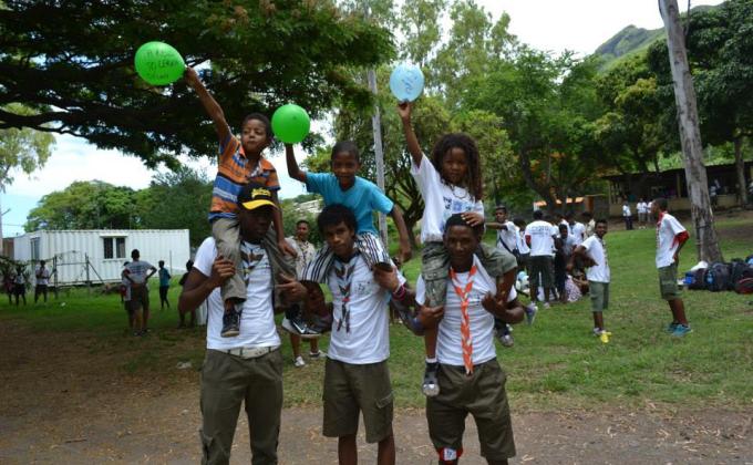 scouts putting a smile on a child face (half day with children from poor regions)