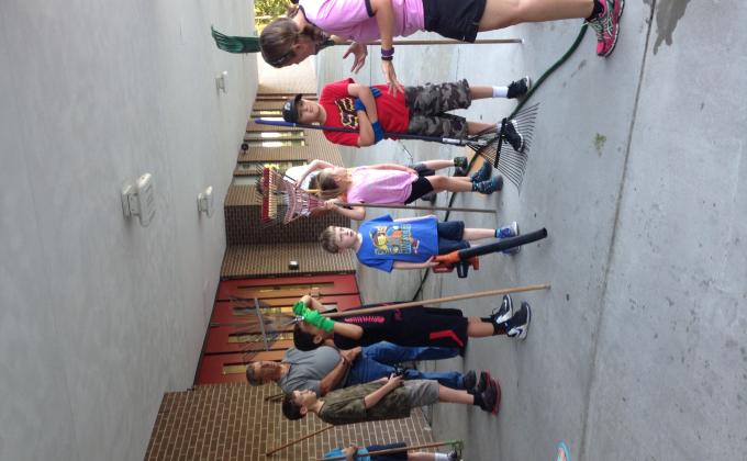 Cub Scout Pack 342 of Newport News, VA clean school grounds at BC Charles Elementary School