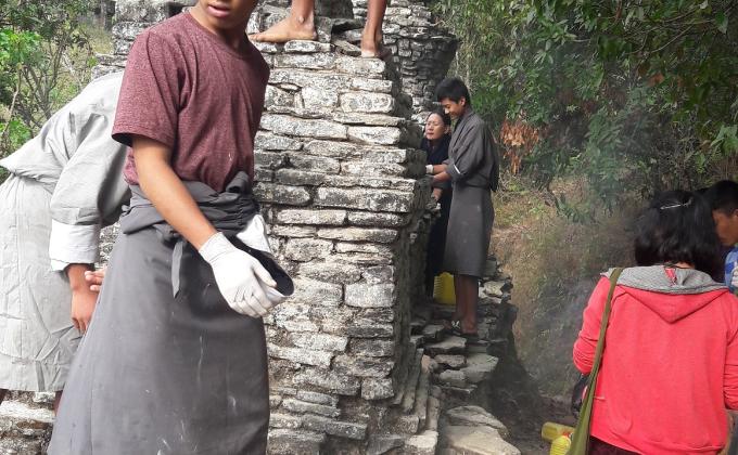 Community services in white washing stupas(chorten)
