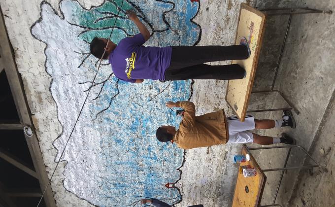 Painting of national flag pole and bhutn map on the wall