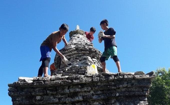 White washing of stupa's during decending day of Lord Buddha.