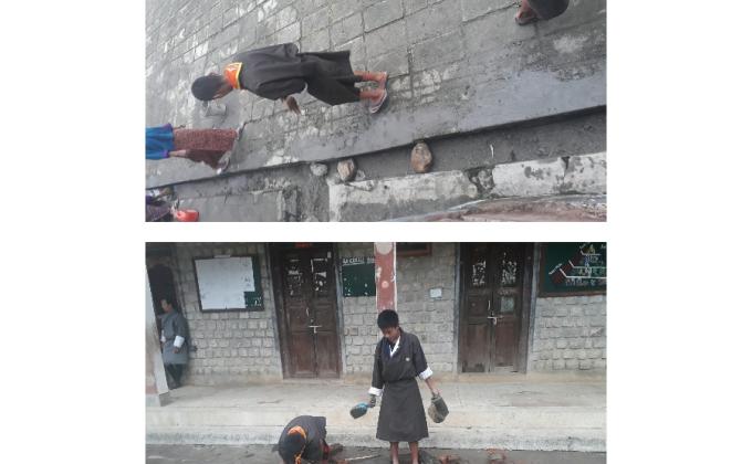 REPAIRING DRAINAGE  IN THR SCHOOL