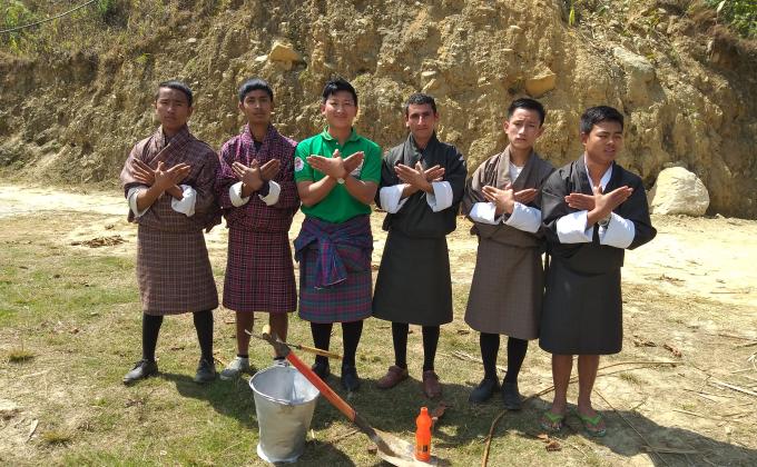 Scouts of Jangchubling volunteer to clean the water source 