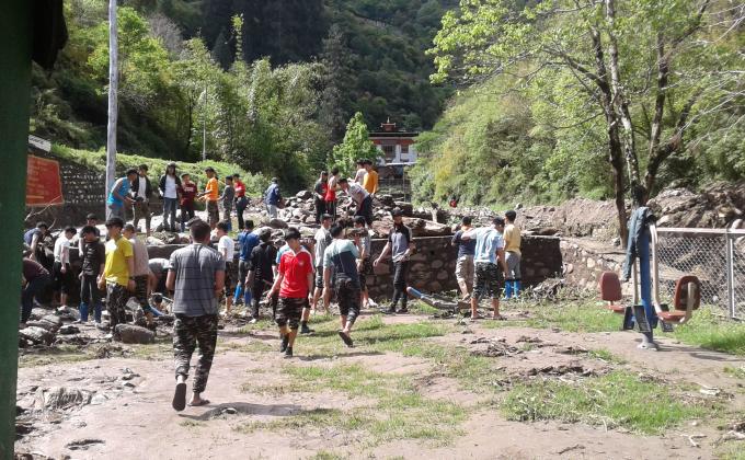 Cleaned around the naykithang at ECCD after flood.