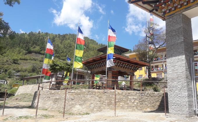 Erection of prayer flags around Mani Dungkhor