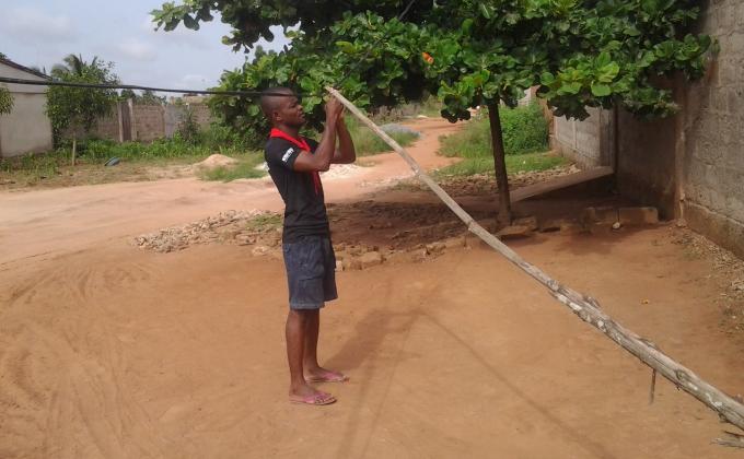 A Scout of Togo and his brother restored a power line in their community