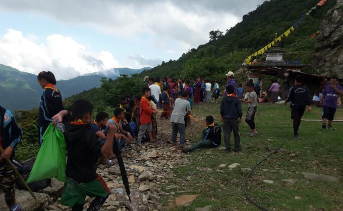 Community service White washing of chorten by scouts