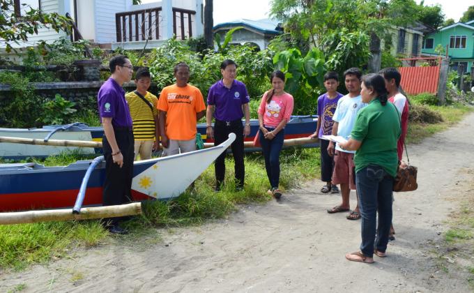 Provide locally-made motor boats and fish nets for three Scout families
