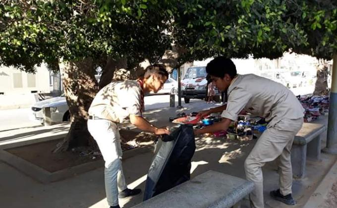 Cleaning the public garden of Tobruk city in Libya