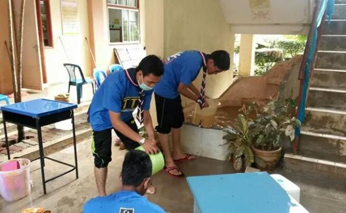 cleaning school after flood